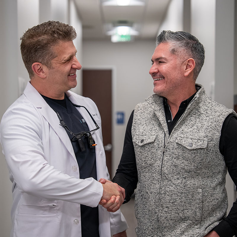 Dr. tooke shaking hands with Gio