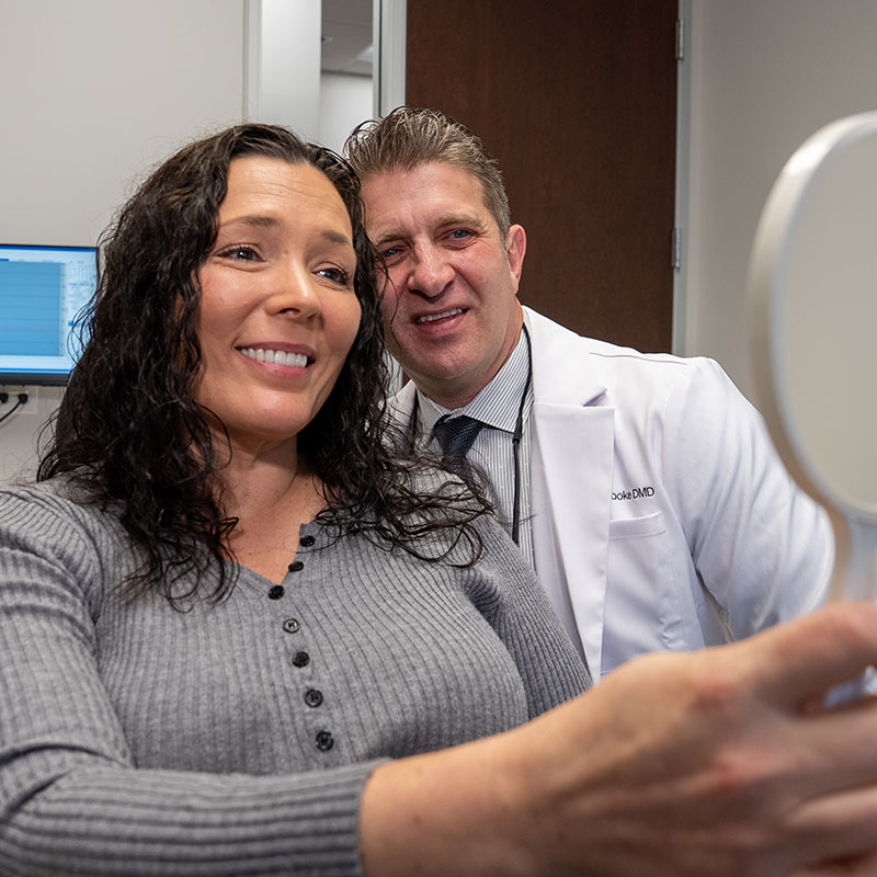 Dr. Justin Tooke and patient smiling